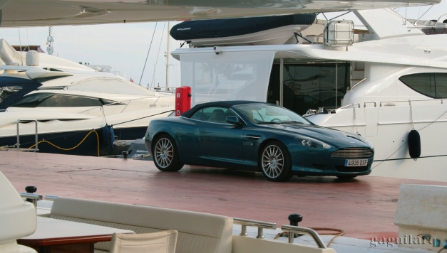 Luxury cars and yachts.  Aston Martin
